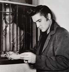 1956 Aug 18_Elvis receiving his first pay check from 20th Century Fox-a.jpg